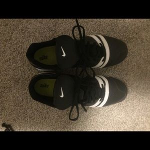 Nike black & White cleats.